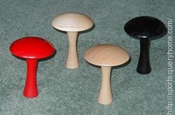 A Bar Billiards table have four mushrooms.